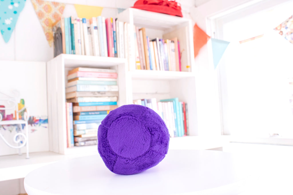 Purple teardrop shaped potion bottle plush toy with a brown top.